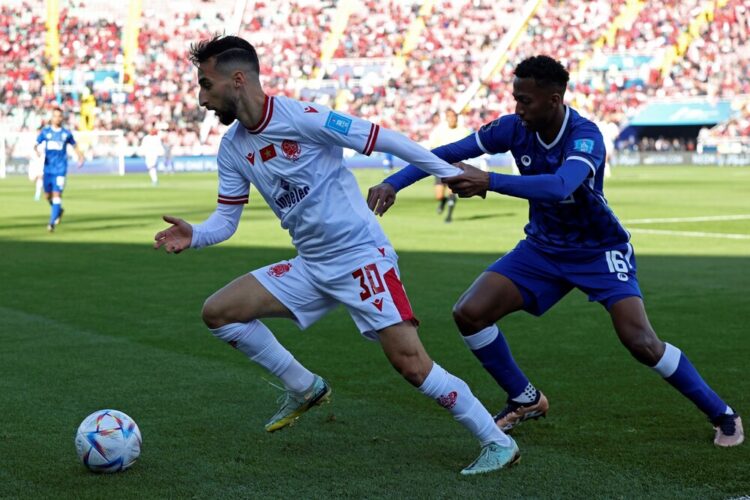 Wydad's Moroccan forward Saifeddine Bouhra fights for the ball with Hilal's Saudi midfielder Nasser al-Dawsari during the FIFA Club World Cup second round football match between Morocco's Wydad AC and Saudi Arabia's Al-Hilal at the Prince Moulay Abdellah Stadium in Rabat on February 4, 2023. (Photo by Fadel SENNA / AFP)