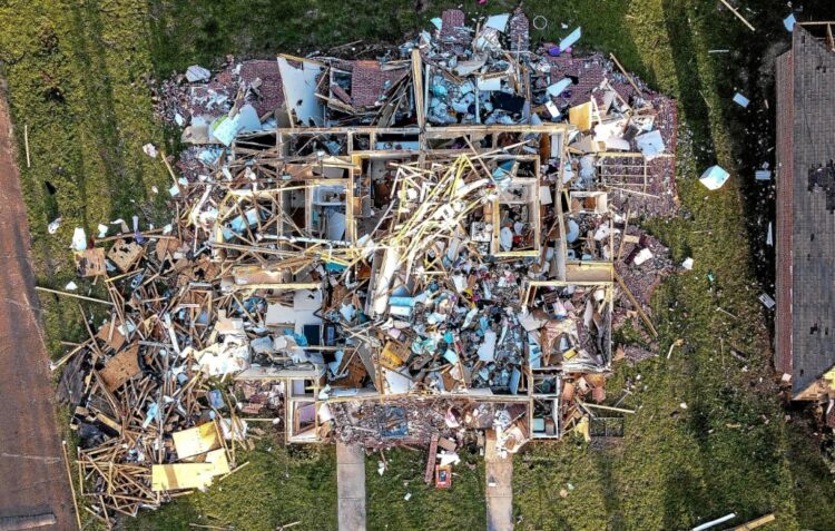 Aerial view of a destroyed neighborhood in Rolling Fork, Mississippi, after a tornado touched down in the area March 25, 2023. At least 23 people died as violent storms and at least one tornado ripped through the southern US state of Mississippi, tearing off roofs and flattening neighborhoods, officials and residents said Saturday. The state's emergency management agency said at least four people were missing and dozens were injured, while tens of thousands of people in Mississippi, Alabama and Tennessee were without power. (Photo by CHANDAN KHANNA / AFP)