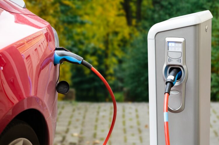 Close up of a charging electric car. Copy space
