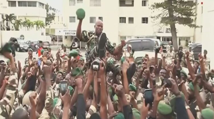 This video grab taken from Gabon 24 on August 30, 2023 shows Gabonese soldiers carrying General Brice Oligui Nguema (C), head of the preisdential guard of ousted President Ali Bongo Ondimba. - The head of Gabon's presidential guard Brice Oligui Nguema was carried aloft by hundreds of soldiers who proclaimed him leader on August 30, 2023, according to images broadcast on state TV.
The footage, which showed soldiers shouting "Oligui president", was played on a loop following a statement read by a coup leader flanked by army officers announcing the house arrest of ousted President Ali Bongo Ondimba, hours after he was declared the winner of the August 26, 2023 election. (Photo by - / Gabon 24 / AFP) / RESTRICTED TO EDITORIAL USE - MANDATORY CREDIT "AFP PHOTO / GABON 24" - NO MARKETING NO ADVERTISING CAMPAIGNS - DISTRIBUTED AS A SERVICE TO CLIENTS - RESTRICTED TO EDITORIAL USE - MANDATORY CREDIT "AFP PHOTO / GABON 24" - NO MARKETING NO ADVERTISING CAMPAIGNS - DISTRIBUTED AS A SERVICE TO CLIENTS /