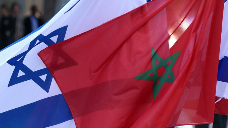 Israeli and Moroccan flags are pictured during an official ceremony in Israel's Mediterranean coastal city of Tel Aviv, on September 13, 2022. (Photo by JACK GUEZ / AFP)
