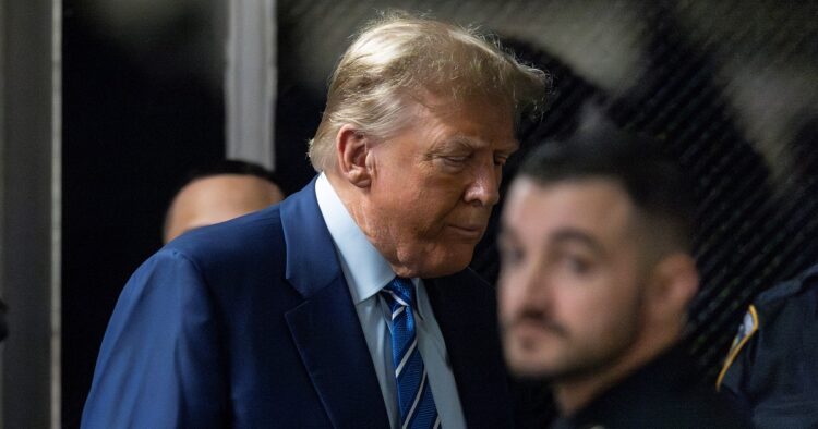 Former President Donald Trump returns to the courtroom on the second day of his trial for allegedly covering up hush money payments linked to extramarital affairs after a recess at Manhattan criminal court on April 16, 2024 in New York. - Trump said April 15, 2024 that he has a "real problem" with the judge handling his New York criminal case -- and that he should be on the campaign trail instead of in court. "We're not going to be given a fair trial," Trump told reporters outside the Manhattan courtroom after jury selection ended for the day in his "hush money" trial, one of four separate criminal cases he faces. (Photo by JUSTIN LANE / POOL / AFP)