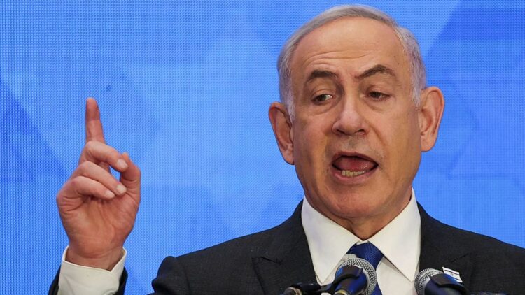 Israeli Prime Minister Benjamin Netanyahu addresses the Conference of Presidents of Major American Jewish Organizations, amid the ongoing conflict between Israel and the Palestinian Islamist group Hamas, in Jerusalem, February 18, 2024. REUTERS/Ronen Zvulun
