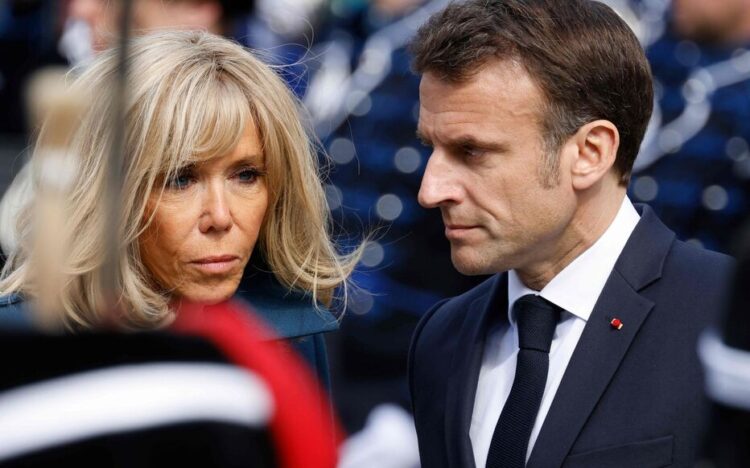 French President Emmanuel Macron and his wife Brigitte Macron are seen during a welcoming ceremony in The Hague on April 11, 2023 as part of a state visit to the Netherlands. (Photo by Ludovic MARIN / AFP)