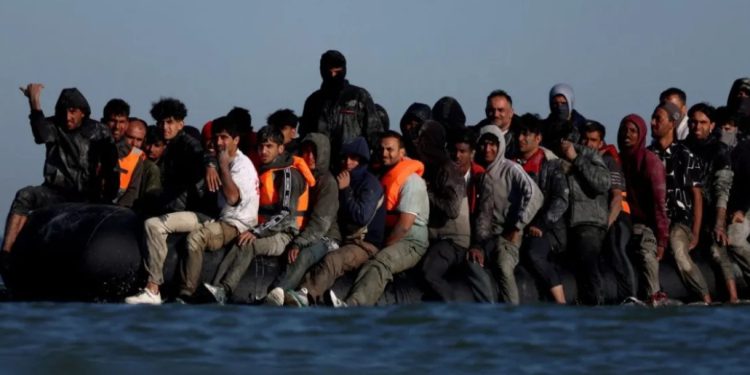 A group of migrants leave the coast of northern France in an attempt to cross the English Channel (Photo: Hannah McKay/Reuters)